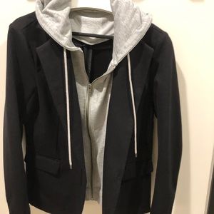 Black blazer with gray hoodie insert.